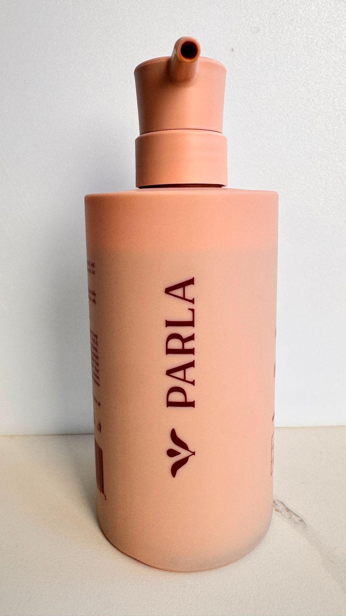 Close-up of a Parla shampoo bottle